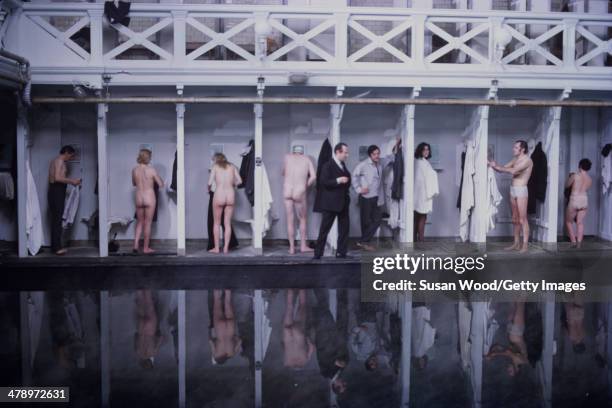 Cast members undress in changing stalls in a scene from the film 'Leo the Last' , England, 1970. Italian film actor Marcello Mastroianni is seen at...