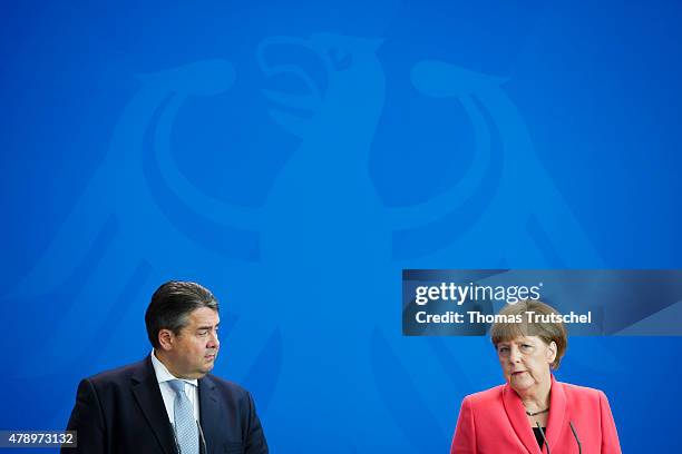 German Chancellor Angela Merkel and Vice Chancellor and Economy and Energy Minister Sigmar Gabriel speak to the media following an extraordinary...