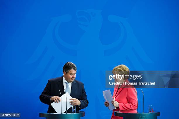 German Chancellor Angela Merkel and Vice Chancellor and Economy and Energy Minister Sigmar Gabriel speak to the media following an extraordinary...