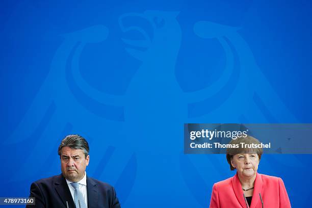 German Chancellor Angela Merkel and Vice Chancellor and Economy and Energy Minister Sigmar Gabriel speak to the media following an extraordinary...