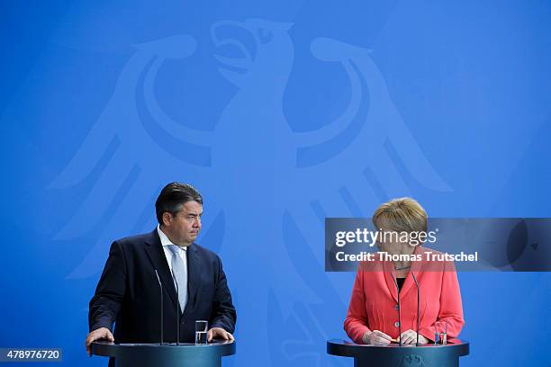 German Chancellor Angela Merkel and Vice Chancellor and Economy and Energy Minister Sigmar Gabriel speak to the media following an extraordinary...