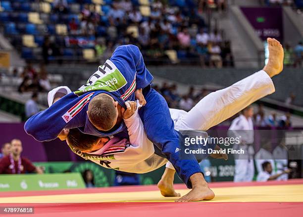 Gabor Ver of Hungary throws Marc Odenthal of Germany for an ippon but couldn't prevent the Hungarian team losing 3 - 2 to Germany at the 2015 Baku...