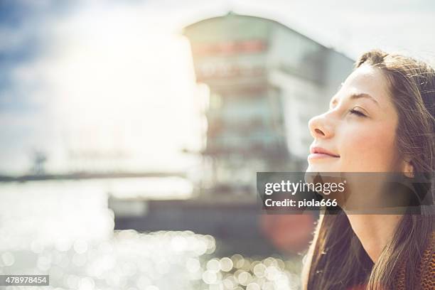 girl enjoying sunlight - port of hamburg stock pictures, royalty-free photos & images