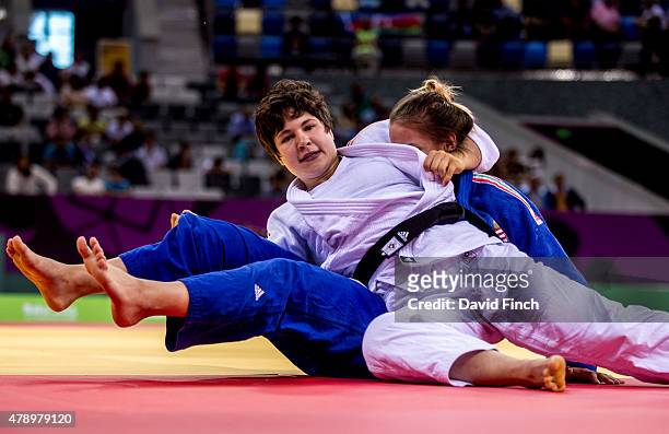 Laura Vargas Koch of Germany holds Szabina Gersack of Hungary for an ippon helping Germany beat Hungary by 3 - 2 on their way to the silver medal at...