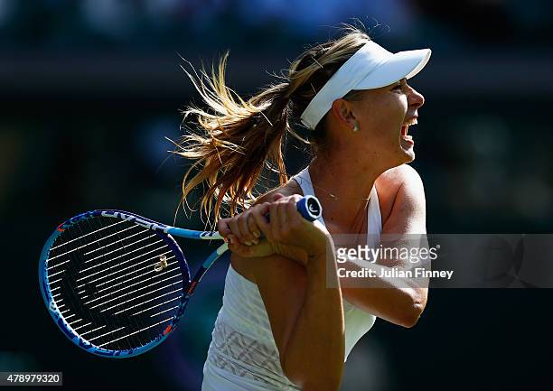 Maria Sharapova of Russia in action in her Ladiess Singles first round match against Johanna Konta of Great Britain during day one of the Wimbledon...