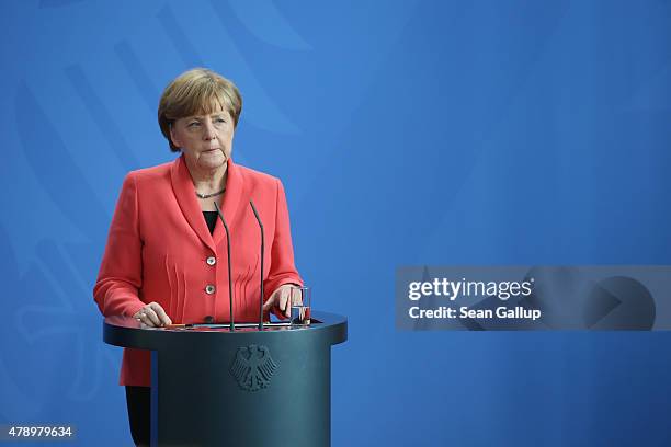 German Chancellor Angela Merkel speaks to the media following an extraordinary meeting with leaders of Germany's main political parties at the...