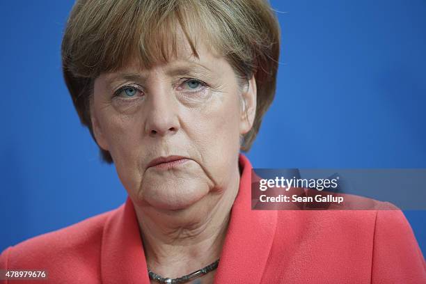 German Chancellor Angela Merkel speaks to the media following an extraordinary meeting with leaders of Germany's main political parties at the...