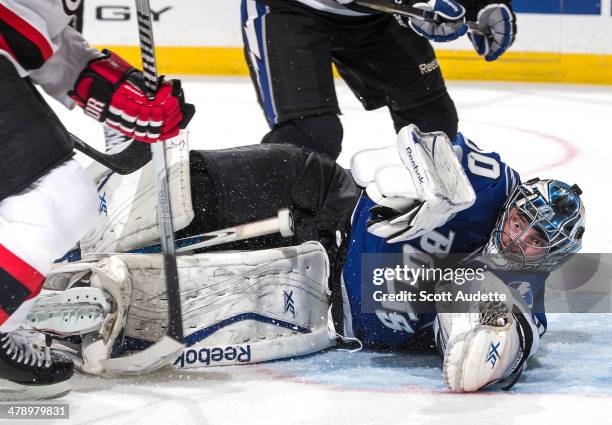 Goalie Ben Bishop of the Tampa Bay Lightning looks for the puck against the New Jersey Devils during the second period at the Tampa Bay Times Forum...