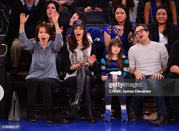 Cheryl Rossum, Emmy Rossum, guest and Mark Ruffalo attend the Milwaukee Bucks vs New York Knicks game at Madison Square Garden on March 15, 2014 in...