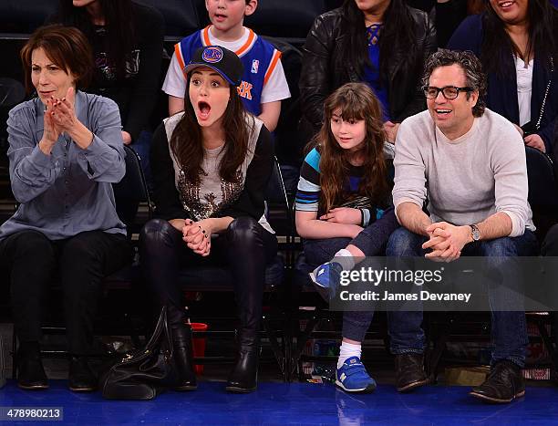 Cheryl Rossum, Emmy Rossum, guest and Mark Ruffalo attend the Milwaukee Bucks vs New York Knicks game at Madison Square Garden on March 15, 2014 in...