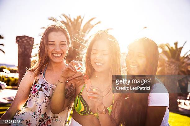 women playing and relaxing at park - hot filipina women stock pictures, royalty-free photos & images