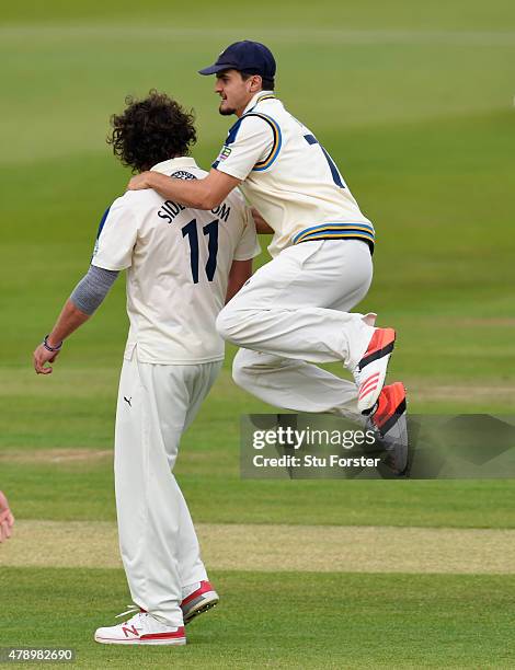 Yorkshire bowler Ryan Sidebottom is congratulated by Jack Brooks after dismissing Michael Richardson during day two of the LV County Championship...