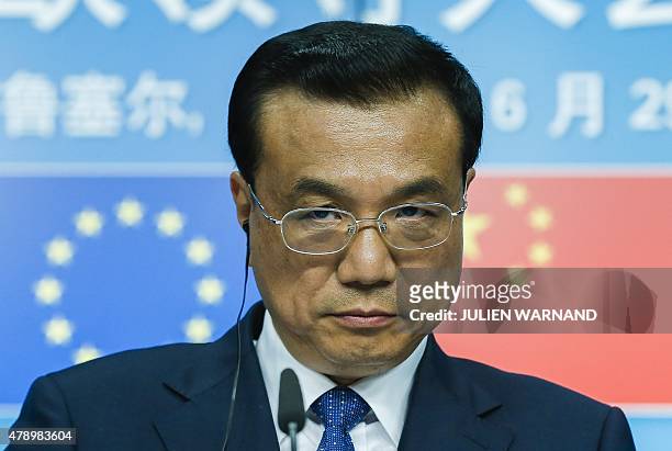 China's Prime minister Li Keqiang gives a joint press conference with European Commission President and European Council President after the 17th...