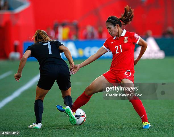 Wang Lisi of China PR against Ali Riley of New Zealand during the FIFA Women's World Cup Canada 2015 Group A match between China PR and New Zealand...