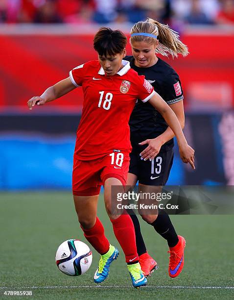 Han Peng of China PR against Rosie White of New Zealand during the FIFA Women's World Cup Canada 2015 Group A match between China PR and New Zealand...