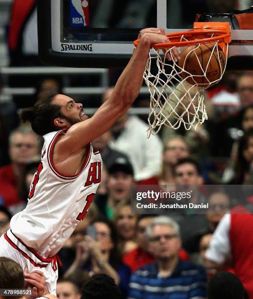 Joakim Noah of the Chicago Bulls dunks against the Sacramento Kings at the United Center on March 15, 2014 in Chicago, Illinois. The Bulls defeated...