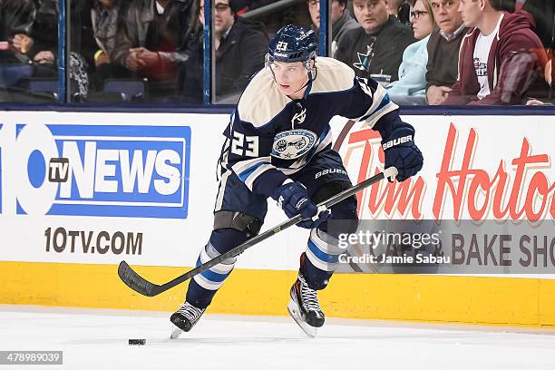 Matt Frattin of the Columbus Blue Jackets skates with the puck against the San Jose Sharks on March 13, 2014 at Nationwide Arena in Columbus, Ohio.