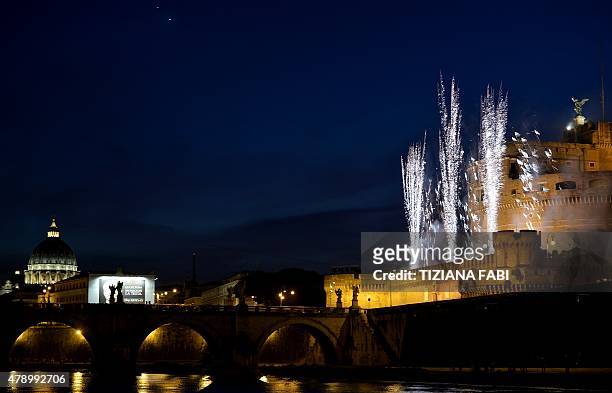 Fireworks burst in the sky over the Castel Sant'Angelo during the traditional 'Girandola', the feast of Romes patron St Peter and Paul, on June 29,...
