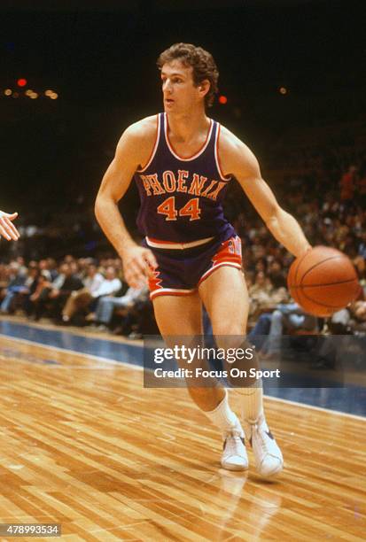 Paul Westphal of the Phoenix dribbles the ball against the New Jersey Nets during an NBA basketball game circa 1978 at the Rutgers Athletic Center in...