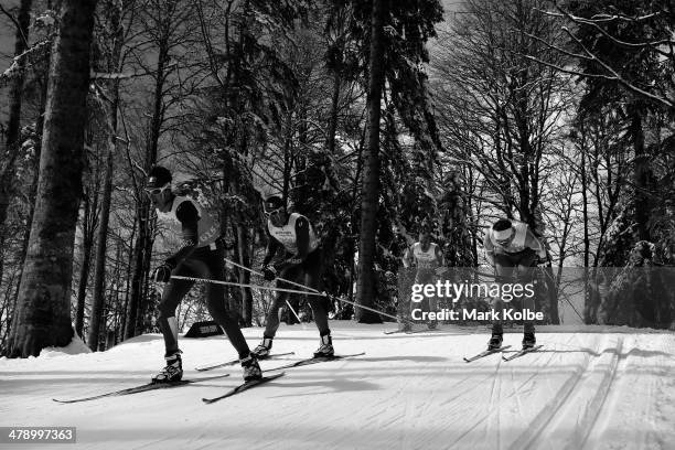 Guide Julien Bourla leads Thomas Clarion of France as they compete in the 4 x 2.5km Open Relay cross-country on day eight of the Sochi 2014...