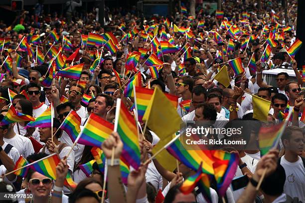 Sea of people waving pride flags walk the route during the 45th Annual San Francisco Pride Celebration & Parade held on Sunday, June 28th, two days...