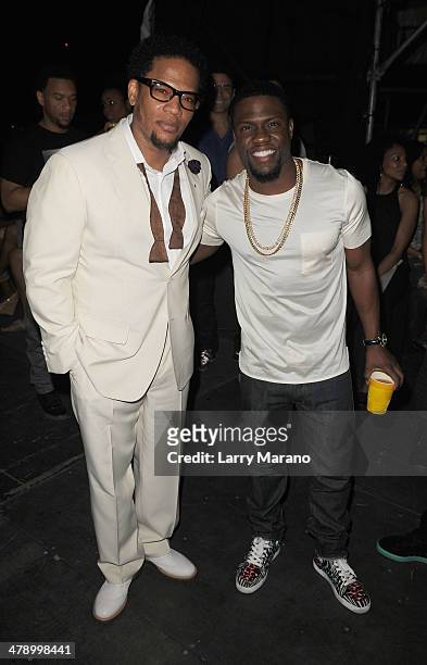Host D.L. Hughley and Comedian Kevin Hart attend Day 1 of Jazz In The Gardens at Sun Life Stadium on March 15, 2014 in Miami Gardens, Florida.