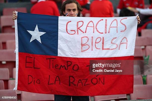 Fan of Chile displays a Chilean flag in support of Marcelo Bielsa, former coach of the Chilean national football team, prior to to the 2015 Copa...