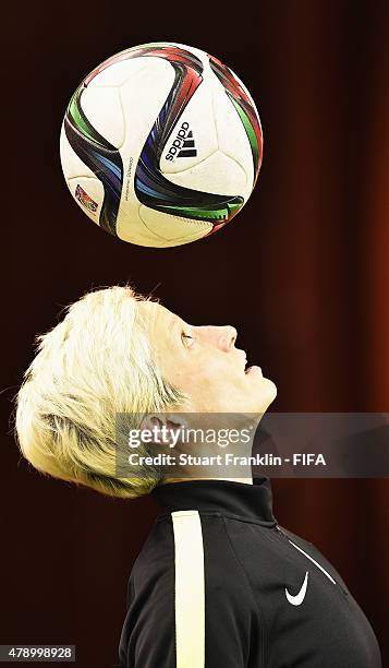 Megan Rapinoe of USA controls the ball with her head during a training session prior to the FIFA Women's World Cup Semi Final match between USA and...