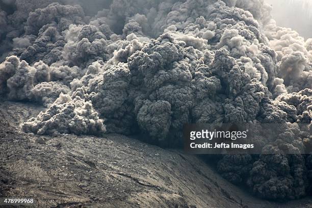Mount Sinabung, continues to erupt and spew gas and ash into the sky on June 29, 2015 in Karo, Indonesia. Around 10,000 people remain in temporary...