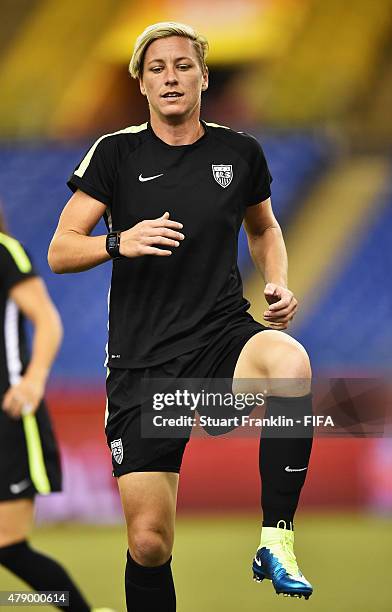 Abby Wambach of USA stretches during a training session prior to the FIFA Women's World Cup Semi Final match between USA and Germany at Olympic...