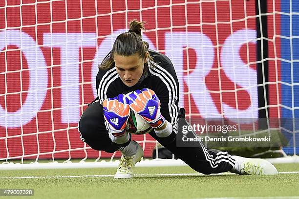 Nadine Angerer of Germany makes a save during a training session at Olympic Stadium ahead of their semi final match against the United States on June...