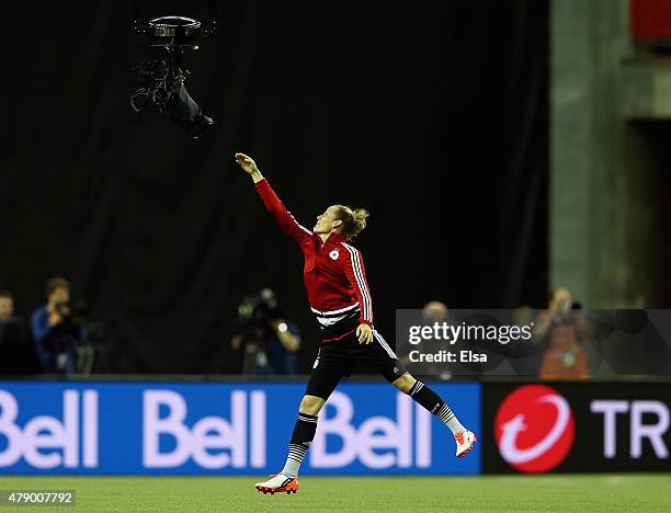 Simone Laudehr of Germany jumps for the Spider camera during training at Olympic Stadium on June 29, 2015 in Montreal, Canada.