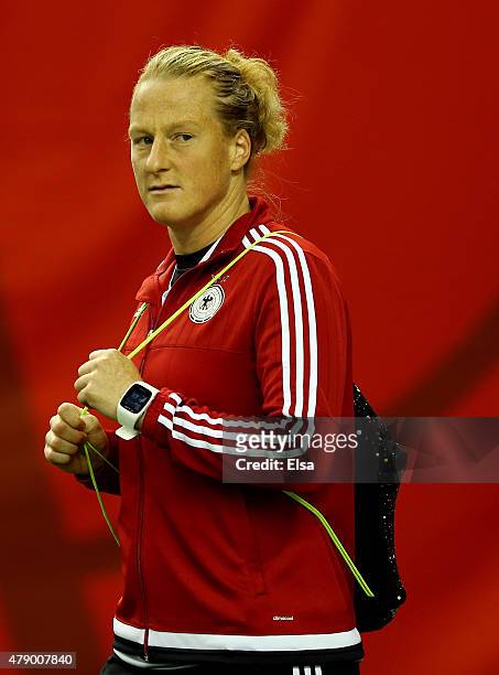 Melanie Behringer of Germany walks onto the pitch before training at Olympic Stadium on June 29, 2015 in Montreal, Canada.