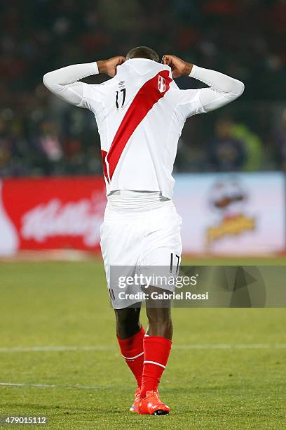 Luis Advincula of Peru takes out his jersey after the 2015 Copa America Chile Semi Final match between Chile and Peru at Nacional Stadium on June 29,...