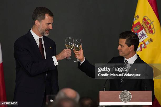 King Felipe VI of Spain and Enrique Peña Nieto President of Mexico make a toast during a state dinner given by Mexican President Enrique Peña Nieto...