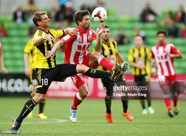 Ben Sigmund of the Phoenix fouls Harry Kewell of the Heart and is subsequently given a red card during the round 23 A-League match between Melbourne...