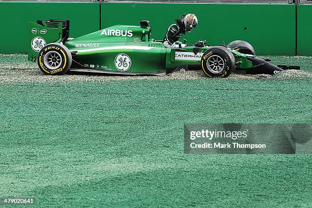 Kamui Kobayashi of Japan and Caterham and Felipe Massa of Brazil and Williams come together and spin out into the gravel at turn one at the start of...