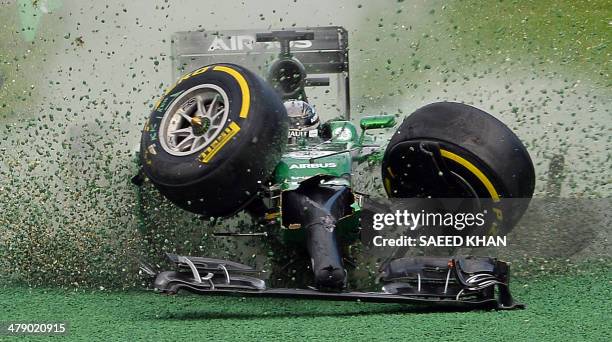 The car of Caterham-Renault driver Kamui Kobayashi of Japan veers off the track during an accident at the start of the Formula One Australian Grand...