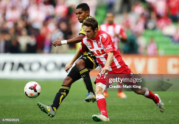 Mate Dugandzic of the Heart competes with Roy Krishna of the Phoenix during the round 23 A-League match between Melbourne Heart and the Wellington...