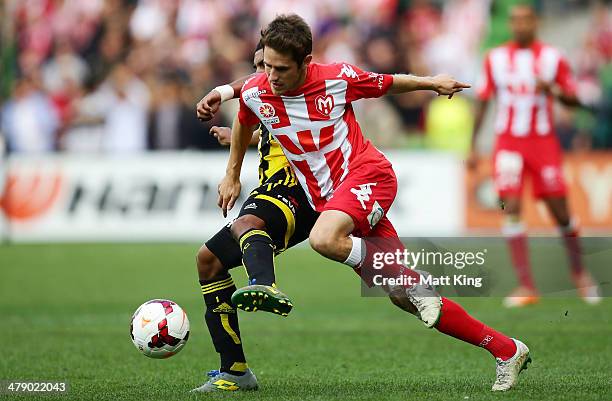 Mate Dugandzic of the Heart competes with Roy Krishna of the Phoenix during the round 23 A-League match between Melbourne Heart and the Wellington...