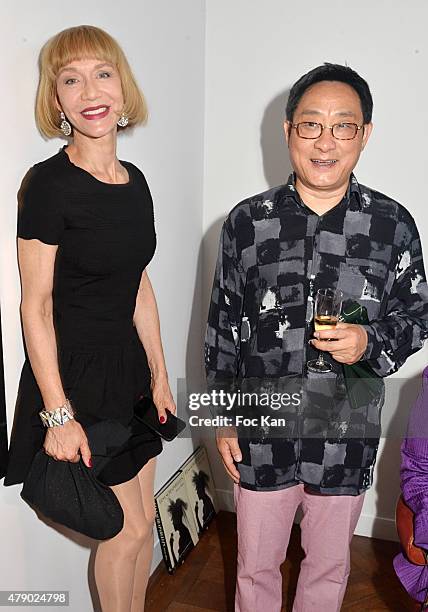 Katinka de Montal and Chinese painter Jiang Shanqing attend the Marisa Schiaparelli Berenson book signing at Christies on June 29, in Paris France.