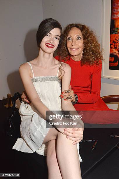 Model Dominique Natalie and Marisa Berenson attend the Marisa Schiaparelli Berenson book signing at Christies on June 29, in Paris France.