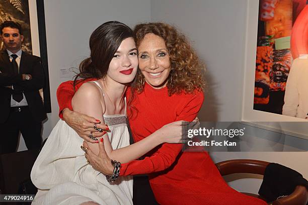 Model Dominique Natalie and Marisa Berenson attend the Marisa Schiaparelli Berenson book signing at Christies on June 29, in Paris France.