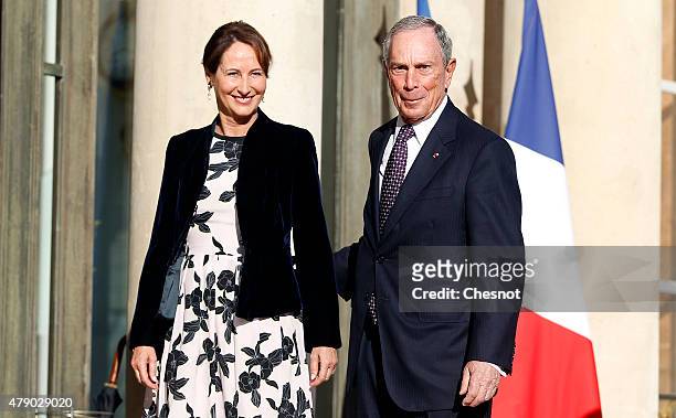 Segolene Royal, French Minister of Ecology, Sustainable Development and Energy welcomes Former New York city Mayor Michael Bloomberg prior to a...