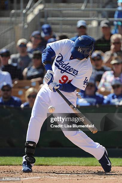 Trayvon Robinson of the Los Angeles Dodgers bats against the San Diego Padres at Camelback Ranch on March 15, 2014 in Glendale, Arizona.