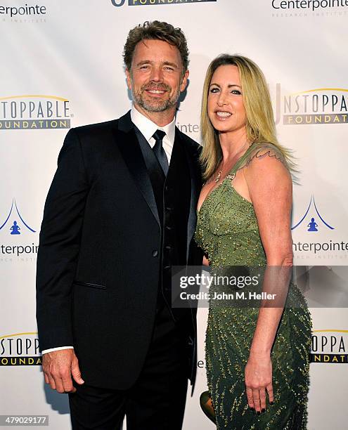 Actors John Schneider and Elly Castle attend the 5th Annual Unstoppable Gala at the Hyatt Regency Century Plaza Hotel on March 15, 2014 in Century...