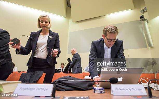 The lawyers of Co-defendant Beate Zschaepe, Wolfgang Heer and Anja Sturm , prepare for another day of the NSU neo-Nazi murders trial on June 30, 2015...