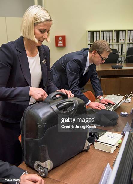 The lawyers of Co-defendant Beate Zschaepe, Wolfgang Heer and Anja Sturm , prepare for another day of the NSU neo-Nazi murders trial on June 30, 2015...