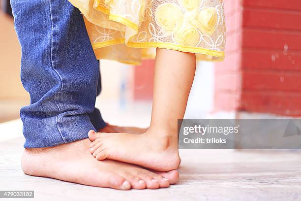 father dancing with his daughter - ballerina feet stockfoto's en -beelden