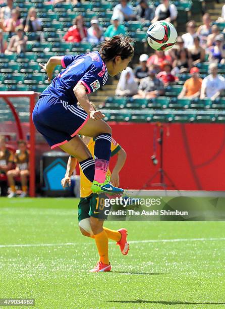 Azusa Iwashimizu of Japan heads the ball during the FIFA Women's World Cup Canada 2015 Quarter Final match between Australia and Japan at...